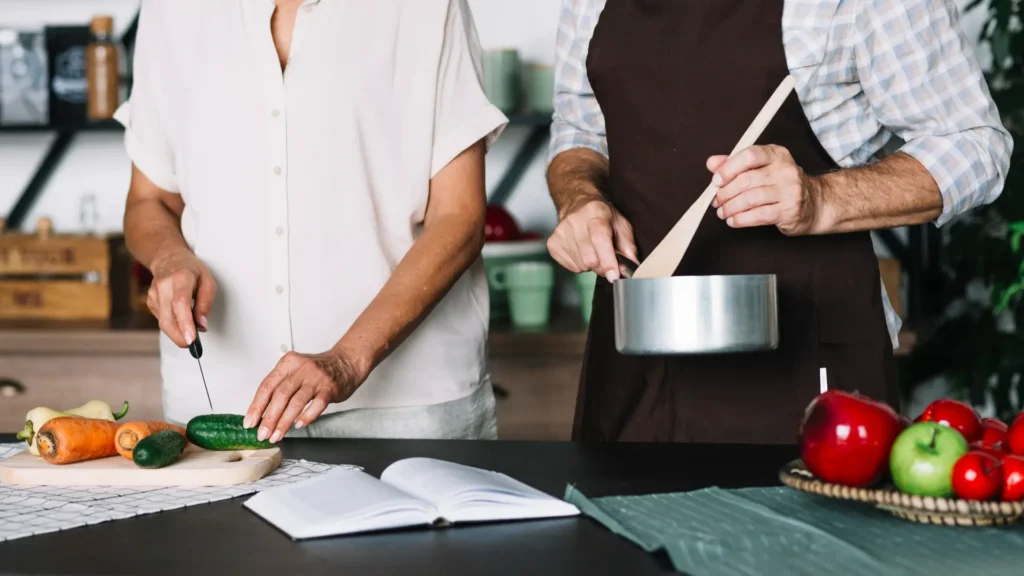 close up senior couple preparing food kitchen 1